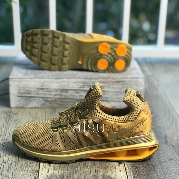 nike shox gravity women's gold